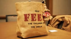 FEED bag is a commemorative tote resembling a burlap bag