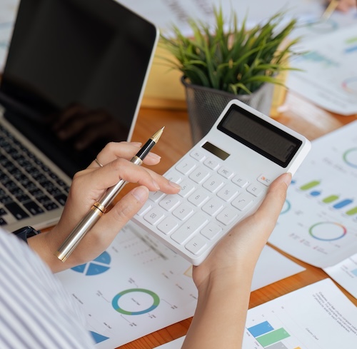 Calculator with paper on desk