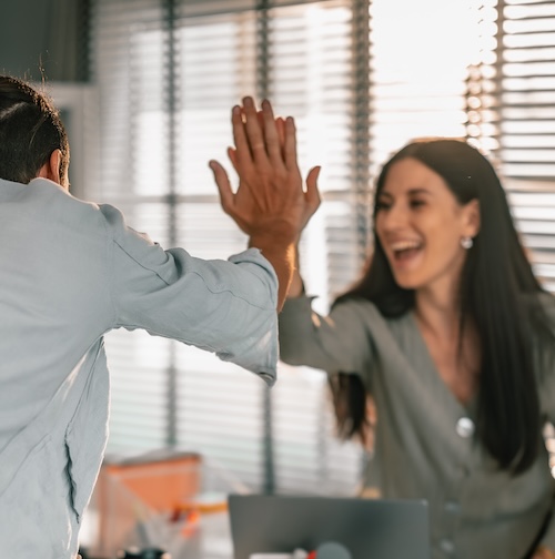Colleagues give high five